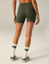green biker shorts with pockets at sides